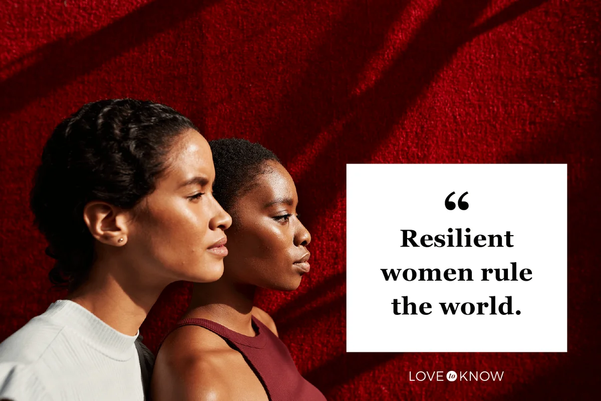 Side view of beautiful women standing against red wall