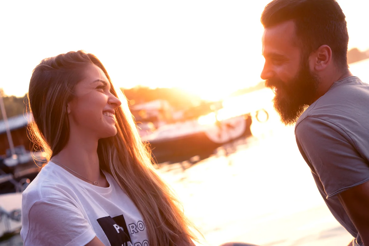 Man and woman flirting and talking outside