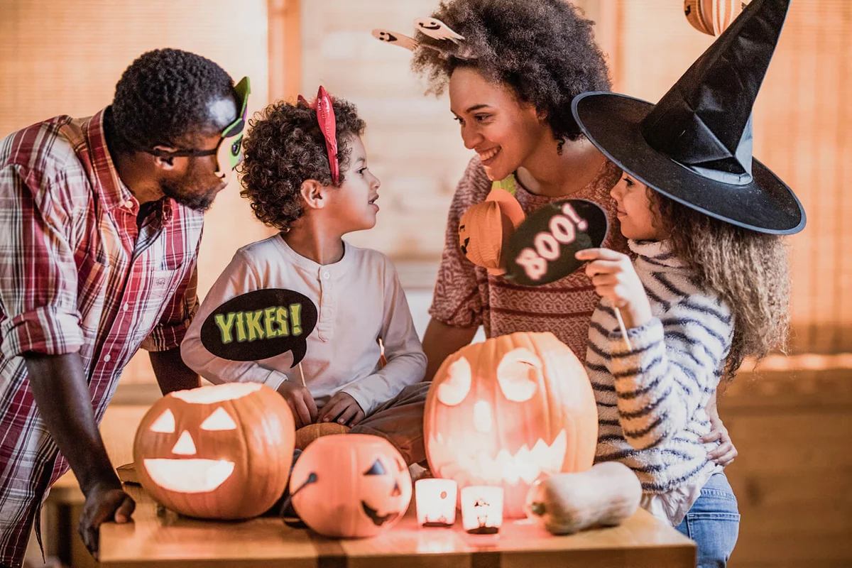 Happy family talking while enjoying Halloween at home