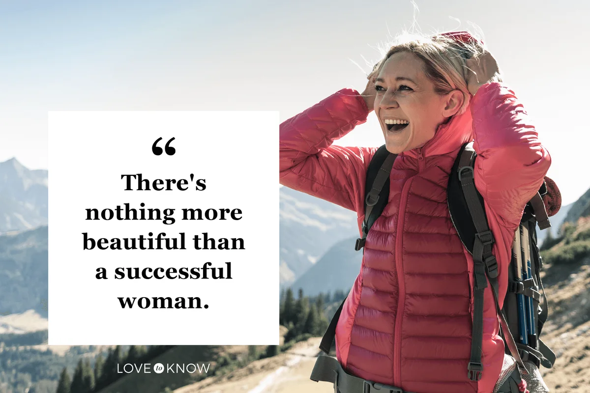 happy woman on a hiking trip in the mountains enjoying the view