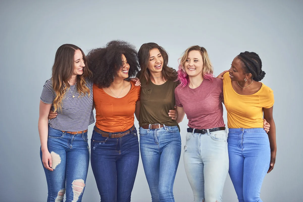 group of attractive young women embracing