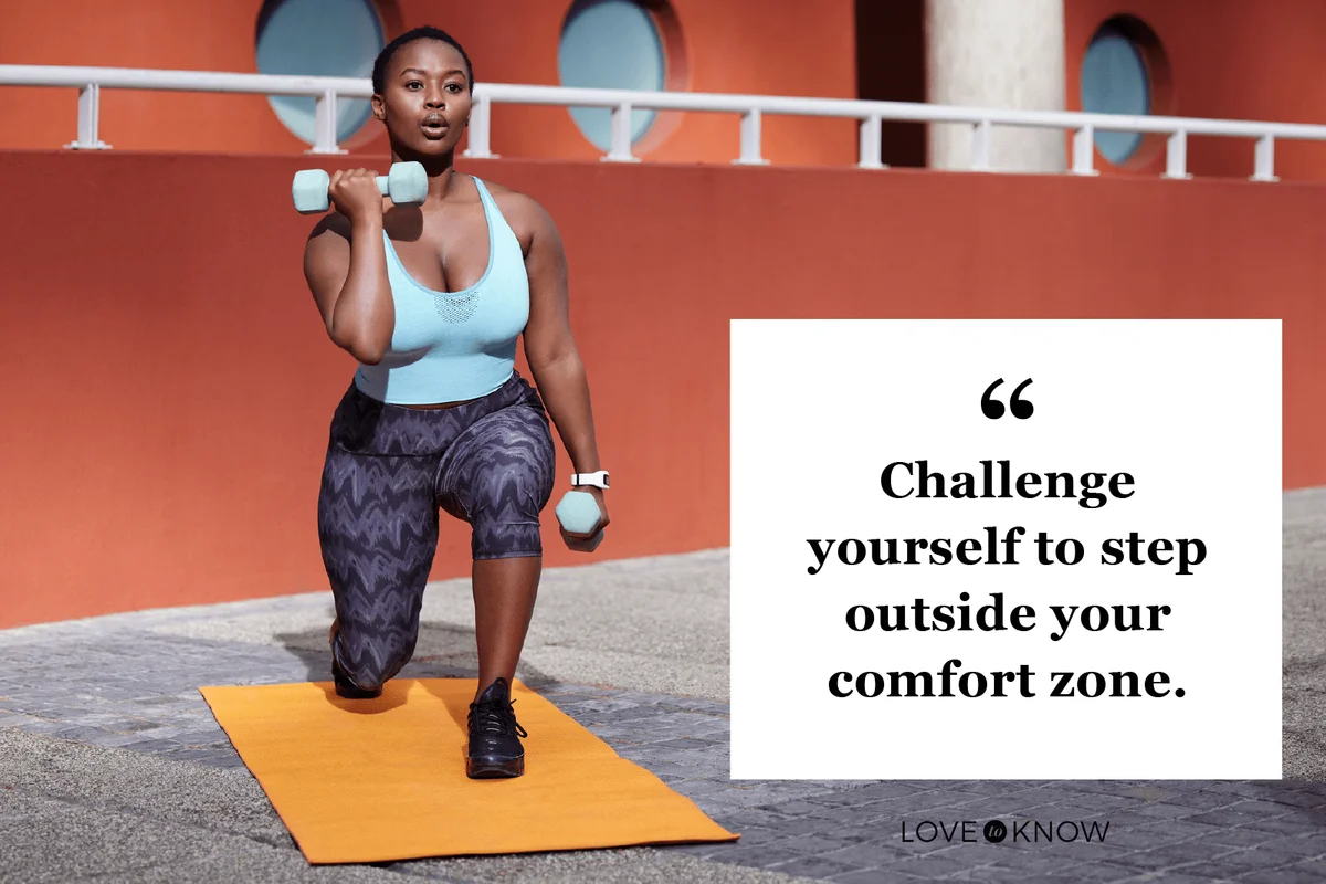 young woman on a gym mat using dummbells