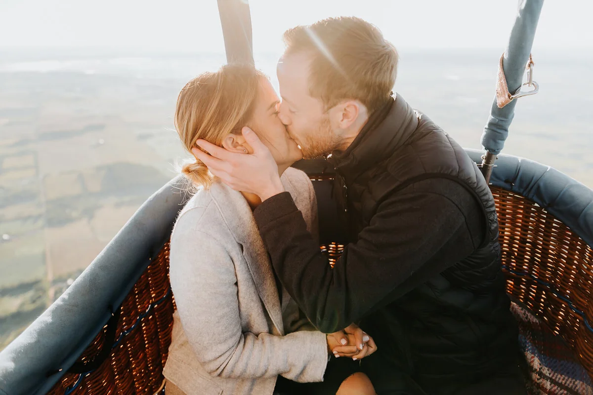 Happy couple in hot air balloon