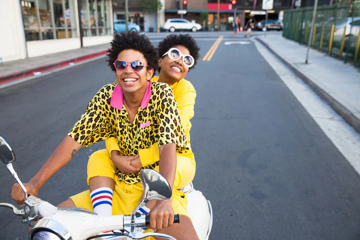 Young couple riding a scooter
