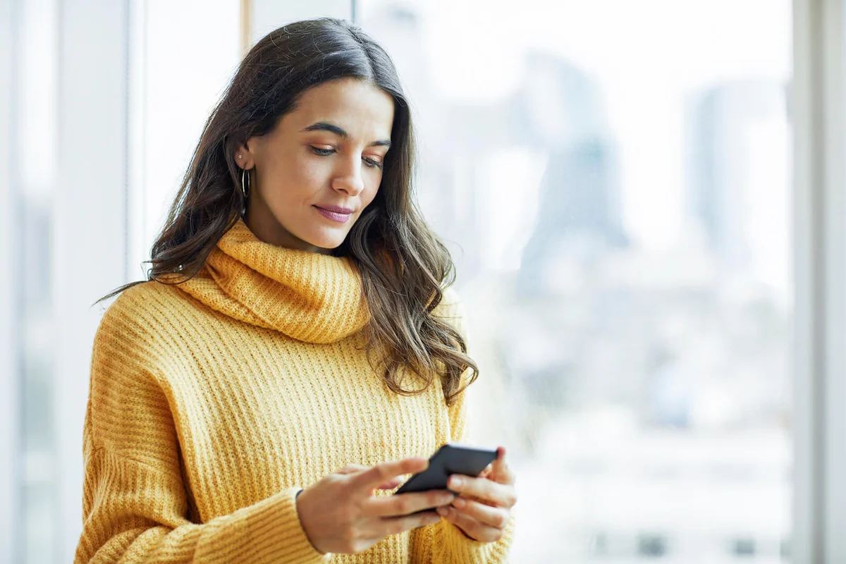 woman holding smart phone