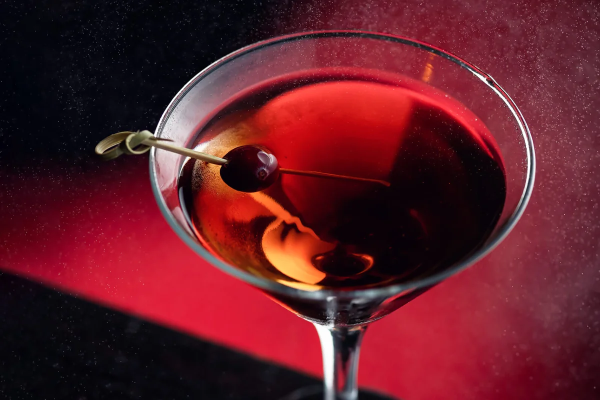 Strong alcoholic cocktail or drink with cherry