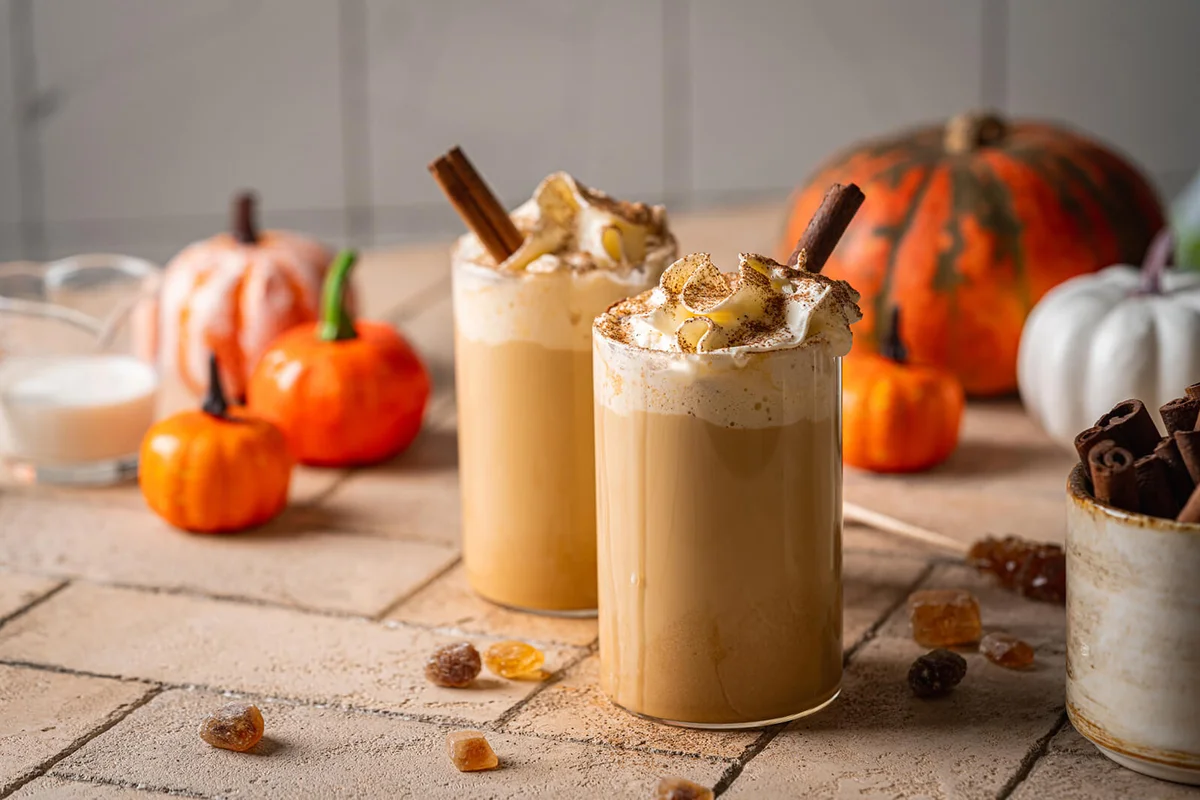 Autumn pumpkin spice latte with whipped cream and cinnamon