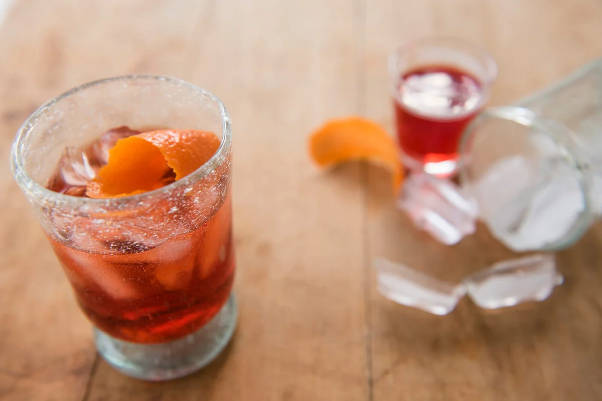 Cocktail in glass on wooden table