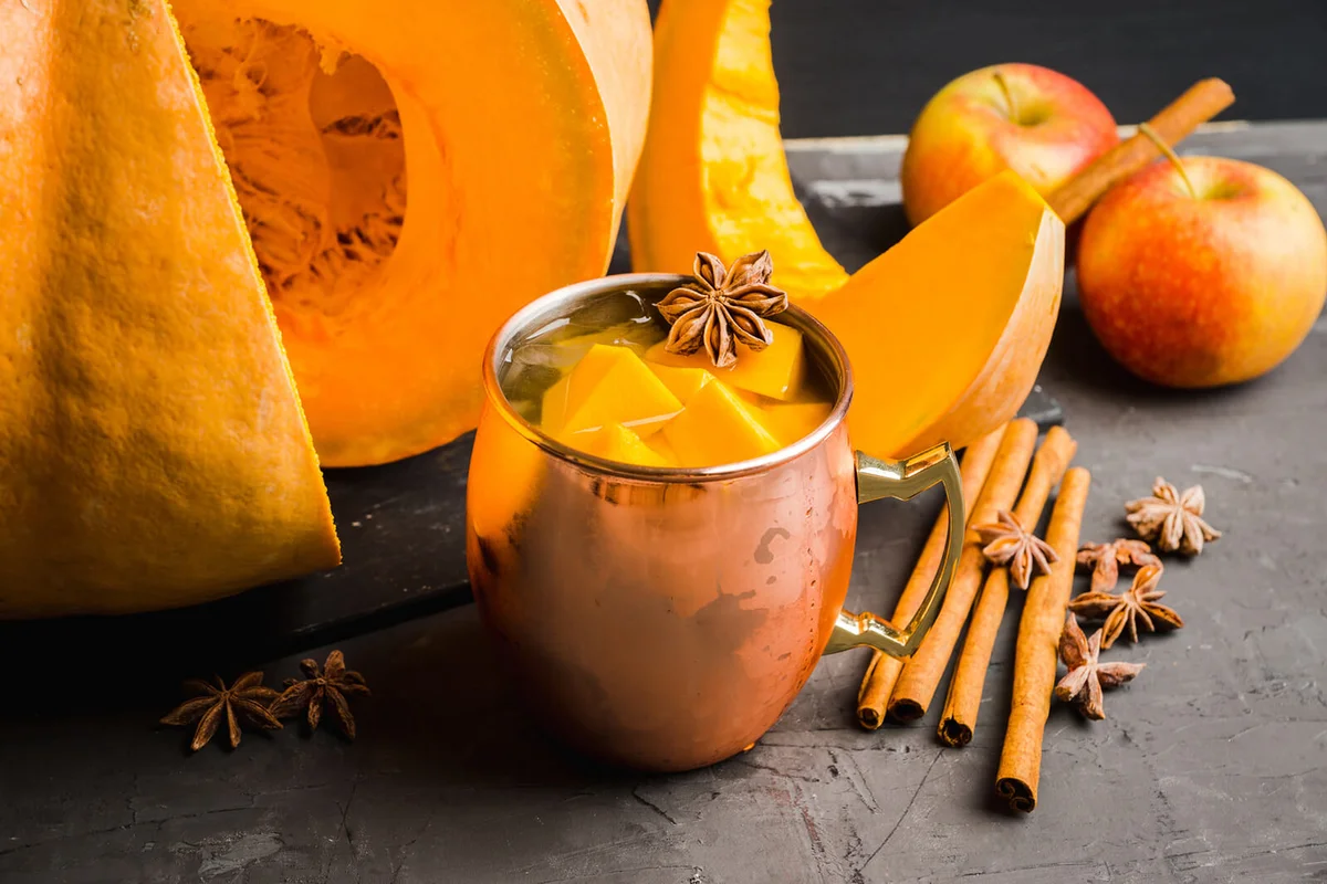 Fresh pumpkin cocktail in copper mug