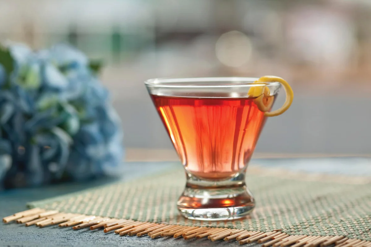 A cosmopolitan with a lemon spiral