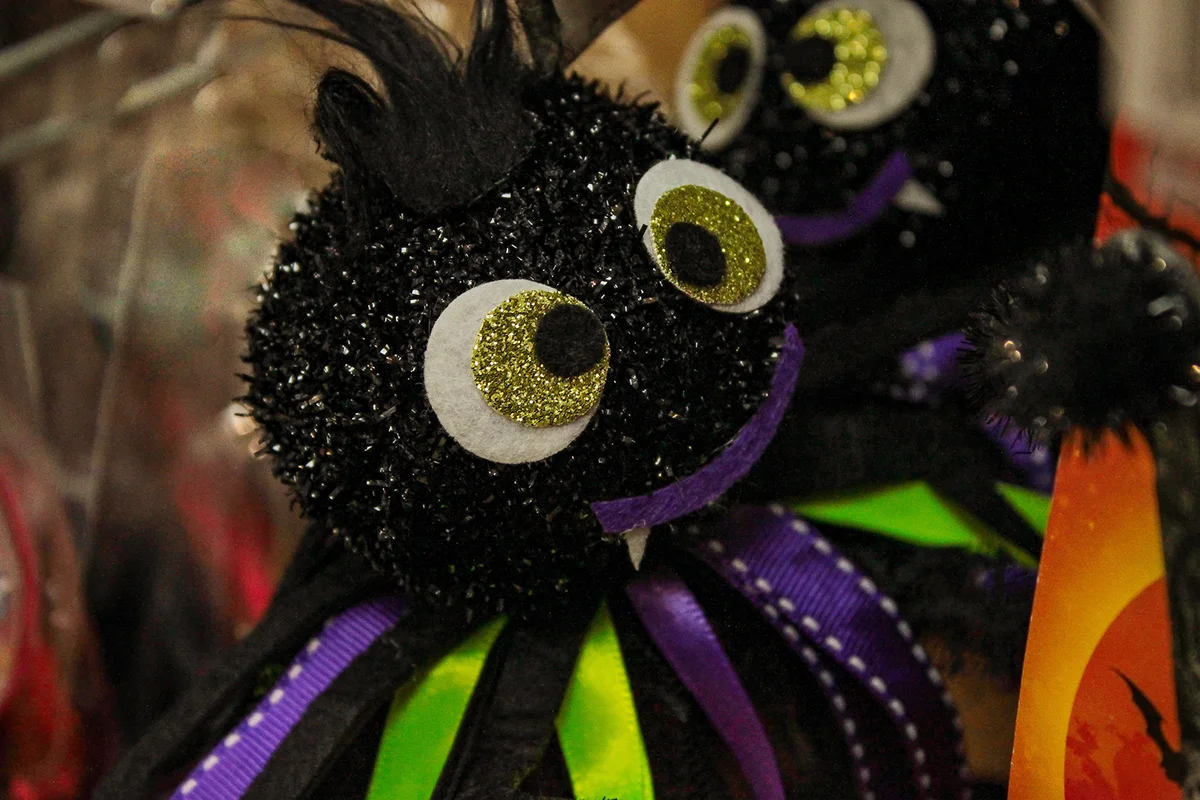 Toy cute black spider with eyes as Halloween decoration