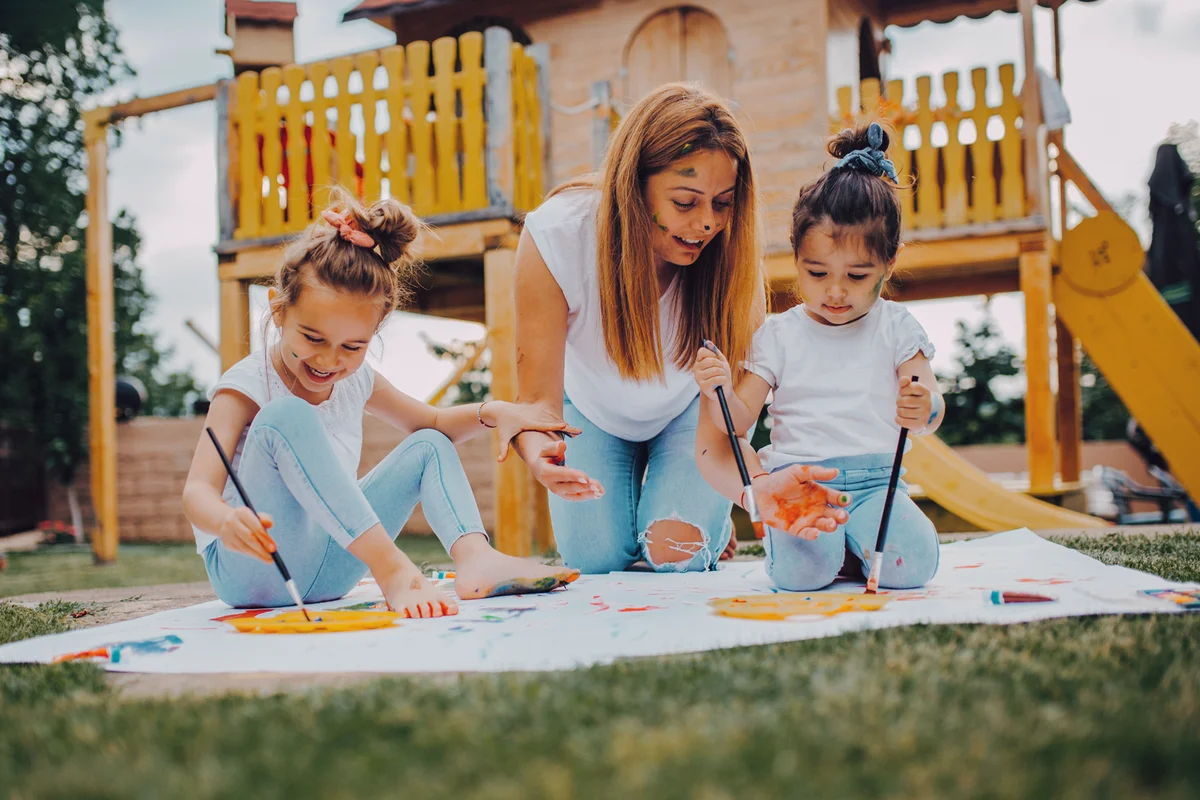 Young mother and daughters having fun time