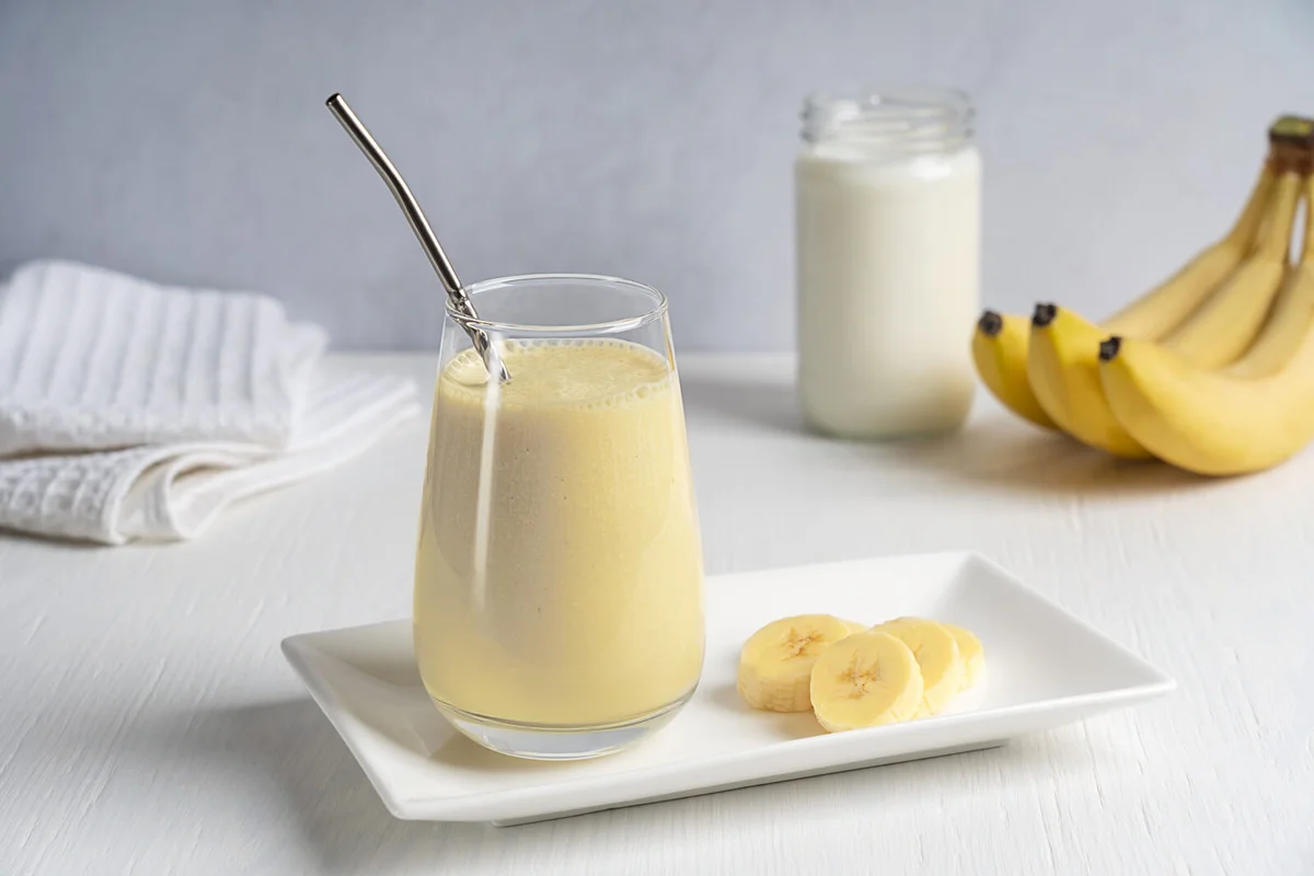 Glass of fresh sweet summer banana milkshake
