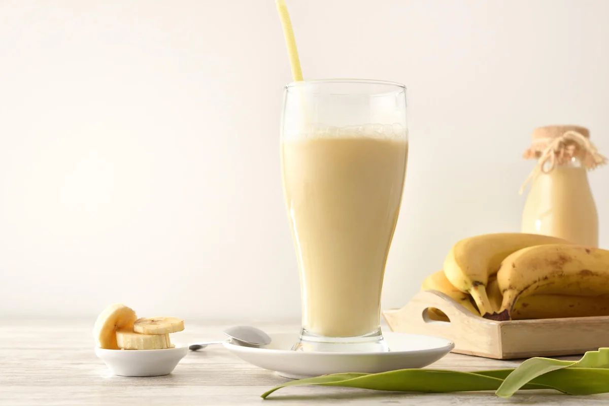 Milkshake with banana in glass cup