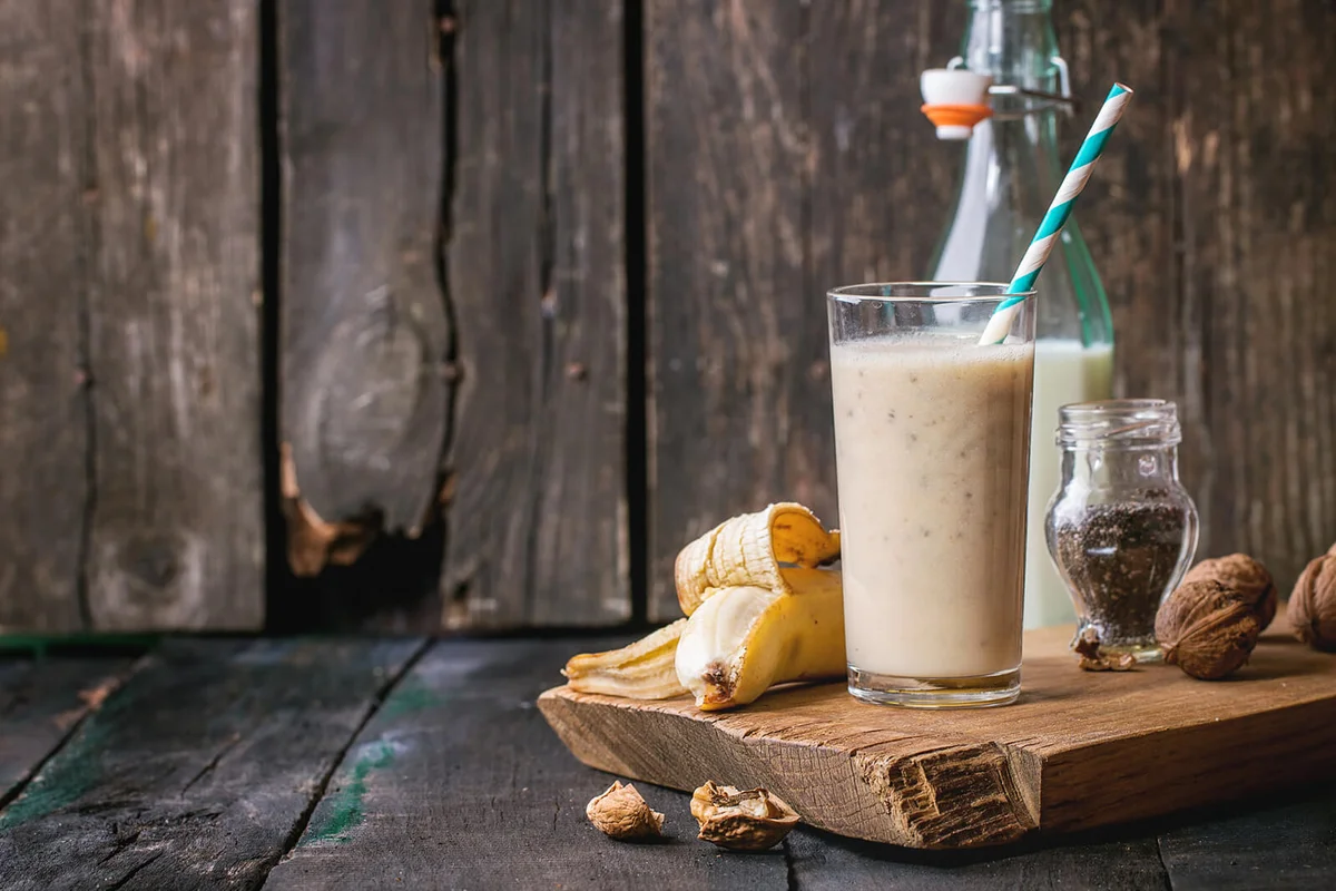 Smoothie And Fruits On Wooden Table