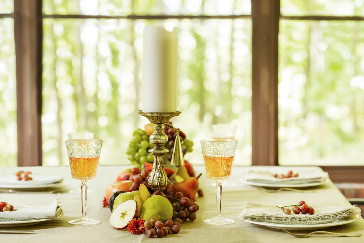 Autumn table decoration with fresh fruits