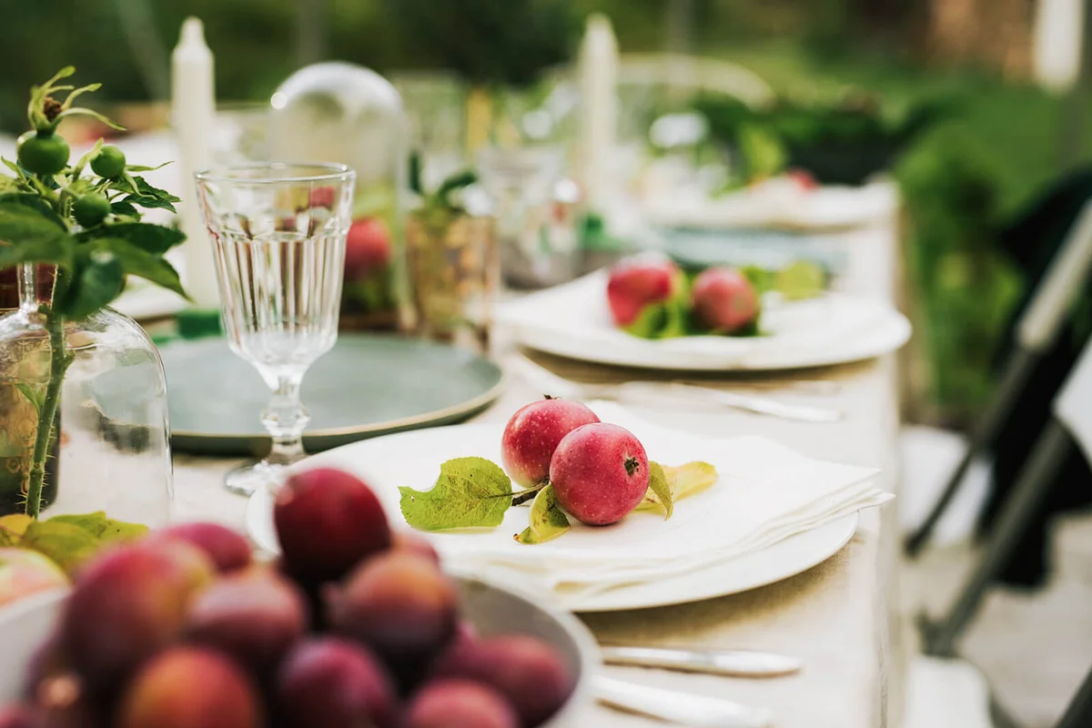 Autumn dinner table with decorative apples homegrown