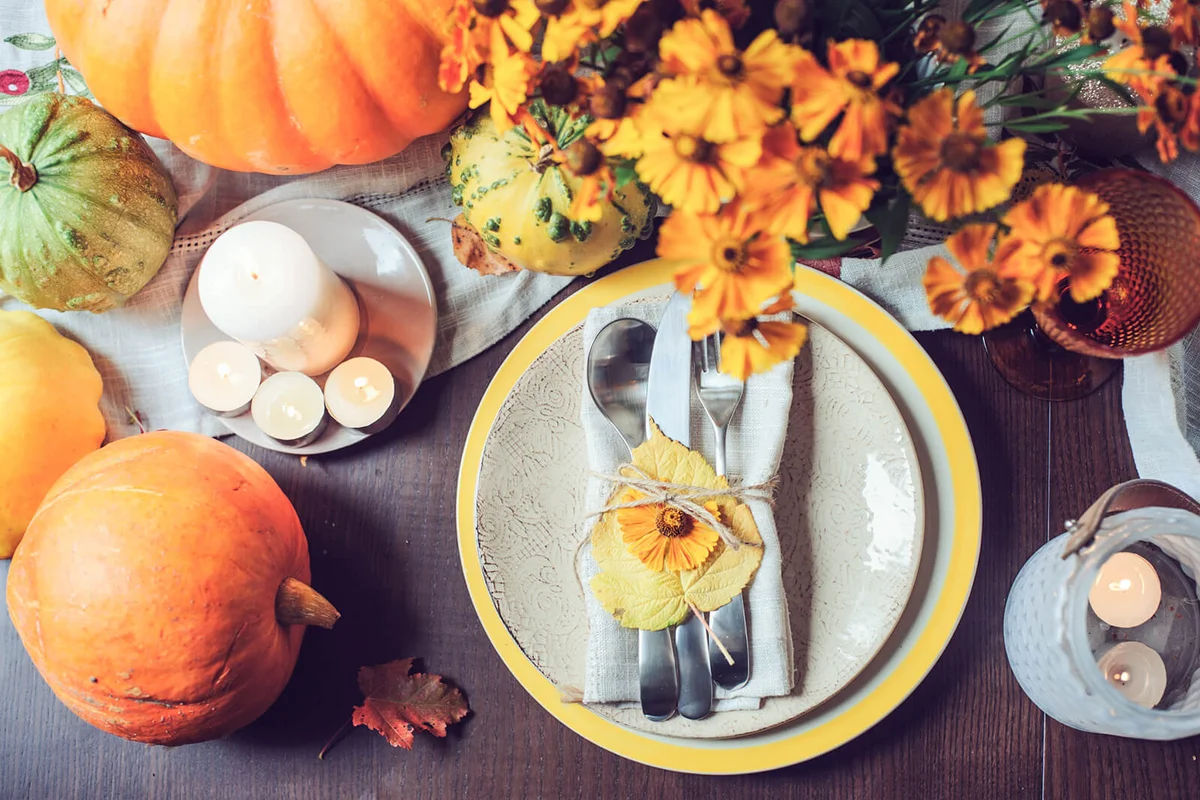 Directly Above Shot Of Plate By Flowers On Table