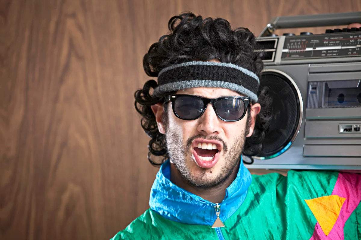 Man wearing dark 80's style glasses