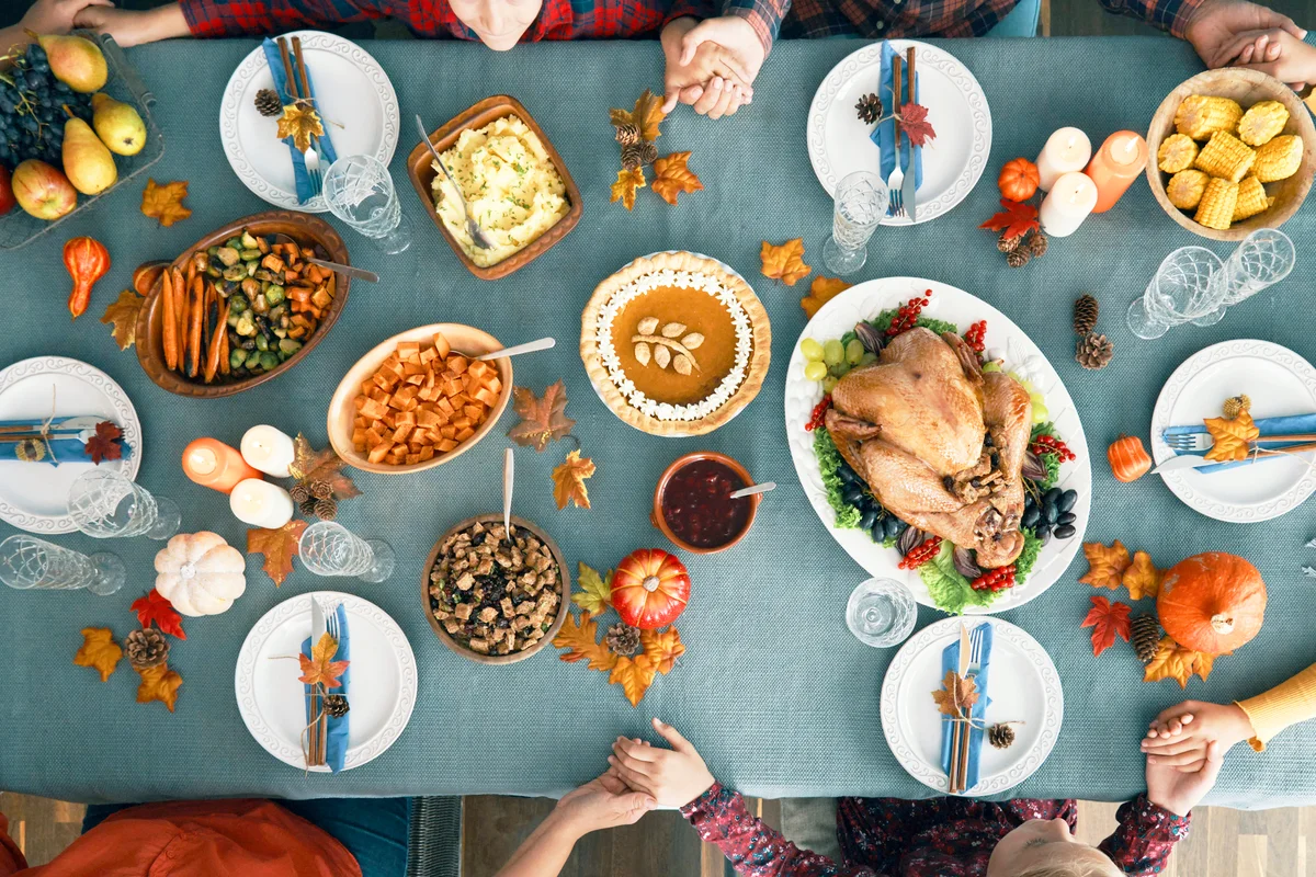 Family Having Traditional Holiday Stuffed Turkey Dinner