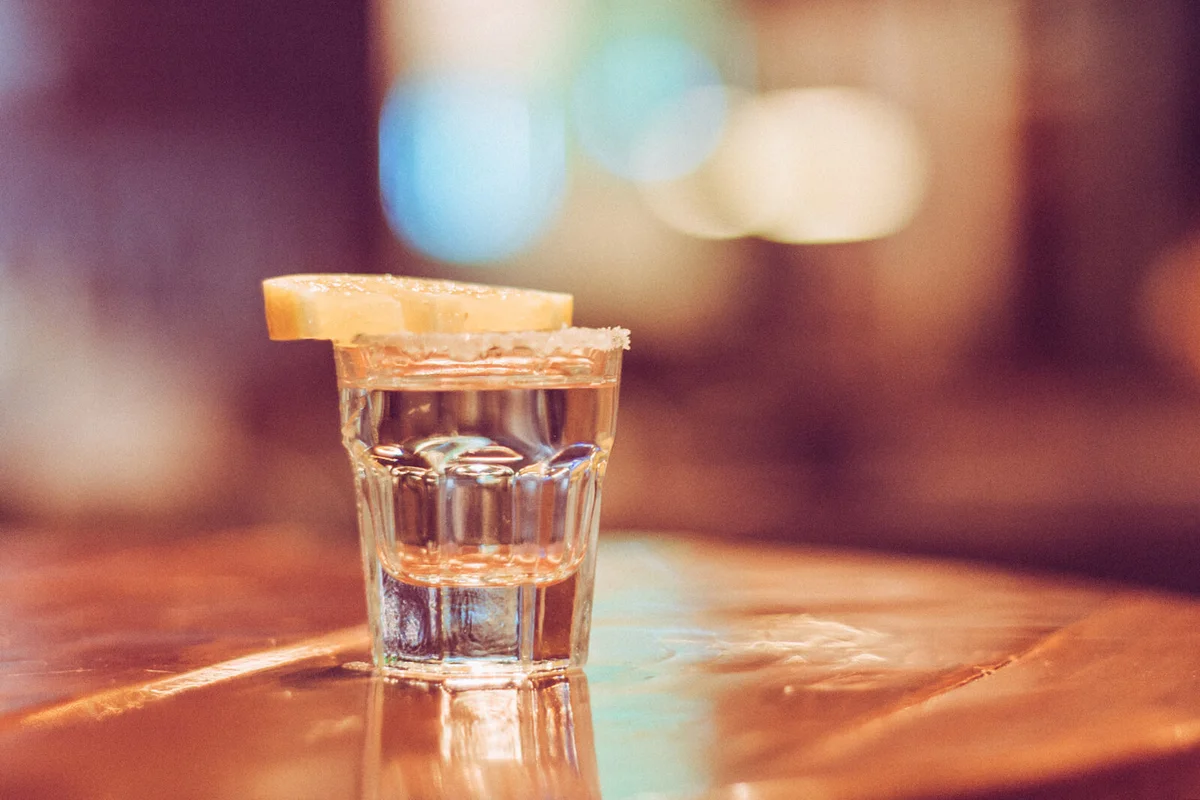 Close-Up Of Lemon Slice With Drink On Table