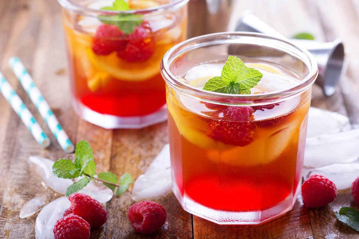 Red summer cocktail with lemons and raspberry | Photo 71483972 © Elena Veselova | Dreamstime.com