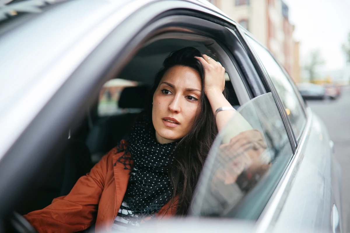 Young woman stuck in traffic