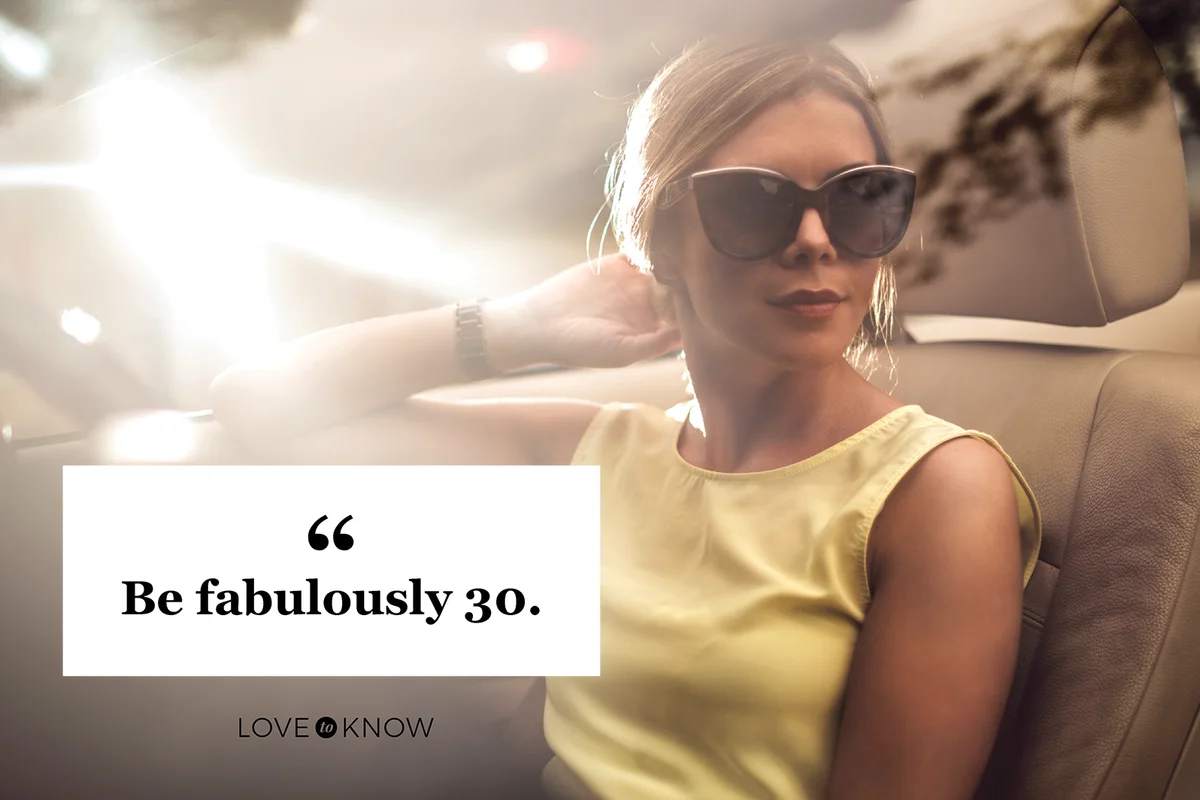 Fashionable woman sitting in convertible car