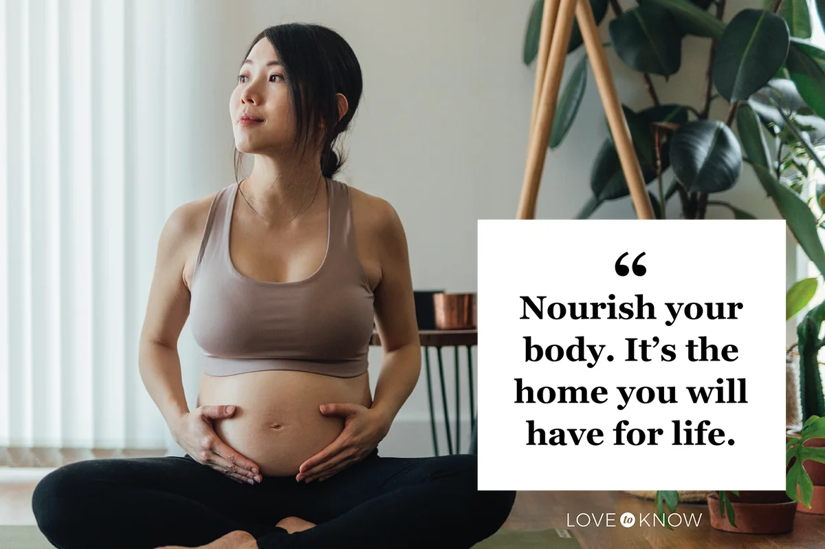 Young Asian Pregnant Woman practicing Yoga At Home