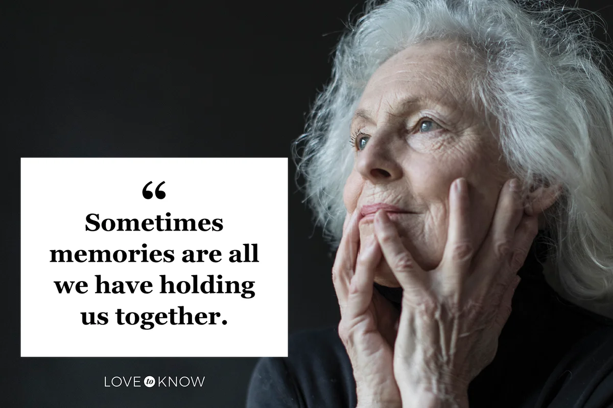 Senior woman holding head in hands reminiscing about the past