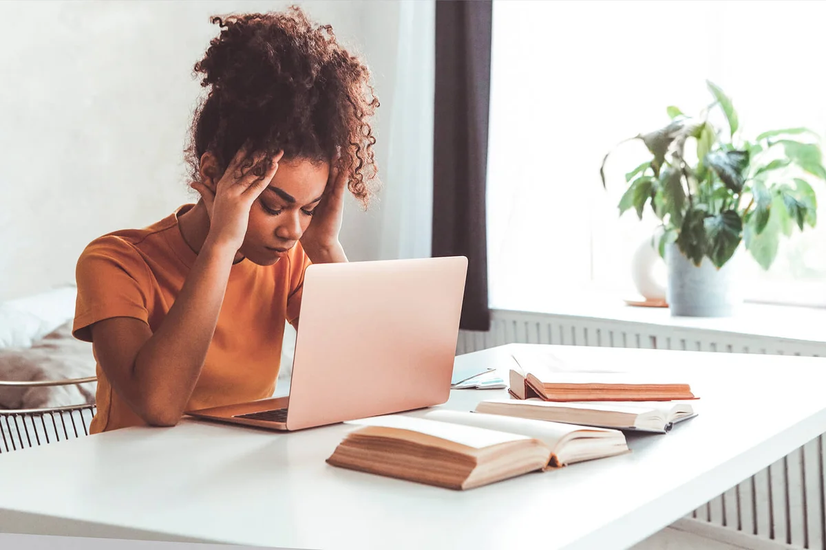 Frustrated Woman Sitting In Front Of Laptop