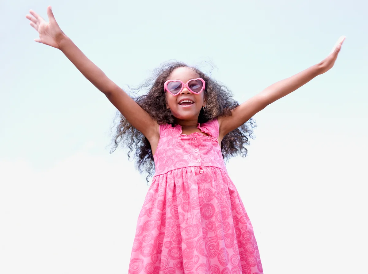 Happy, confident girl with arms outstretched