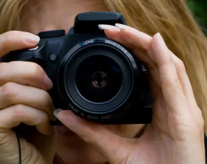 woman using slr camera