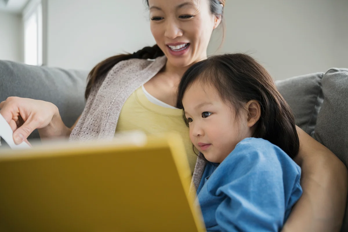 Mother and daughter reading book