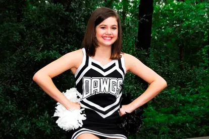 cheerleading in black and white uniform; © Maureen Rigdon | Dreamstime.com