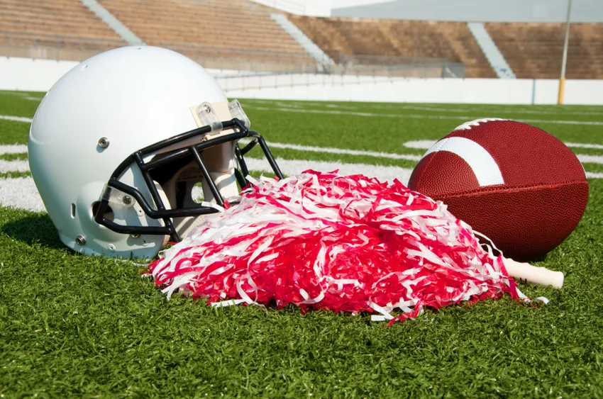 Helmet, football and pom pon