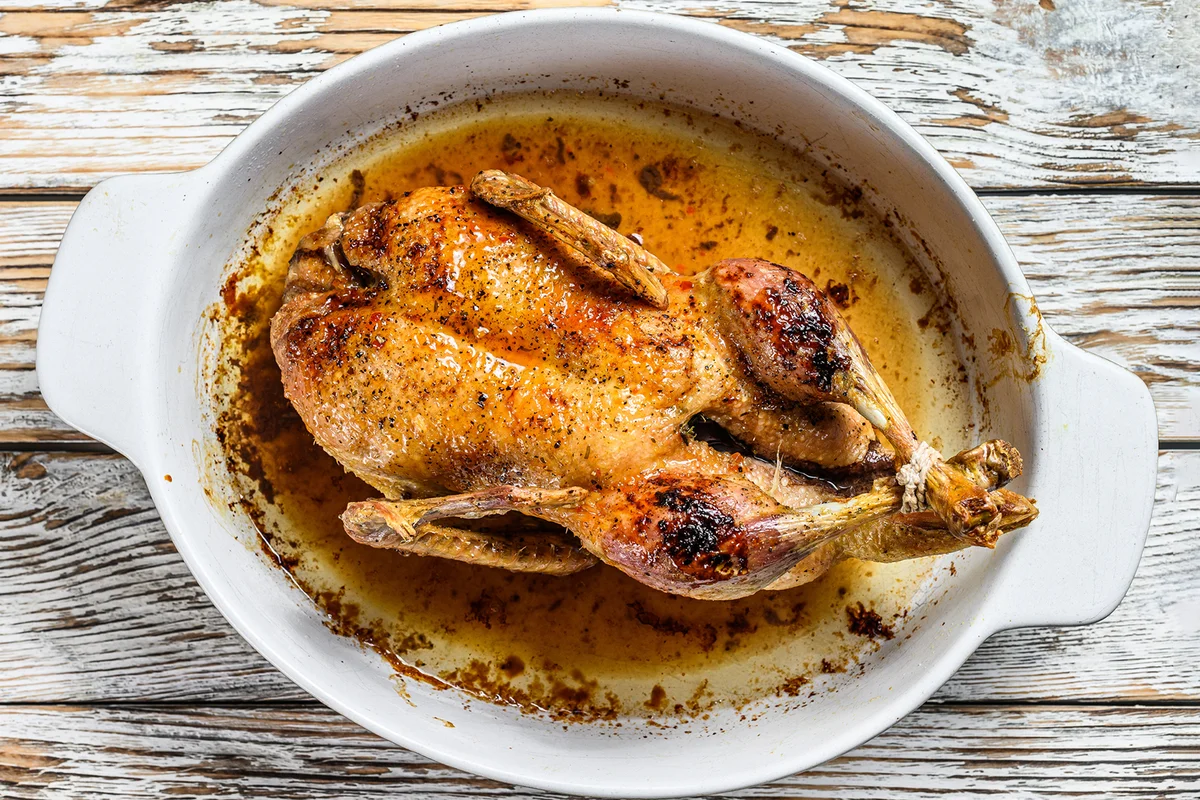 Baked whole farm duck in a baking dish