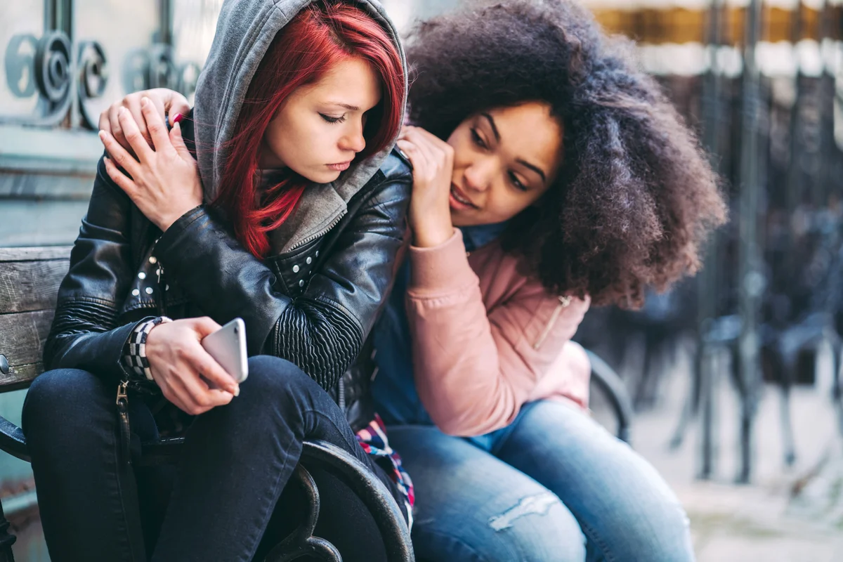 Young woman caring about depressed friend