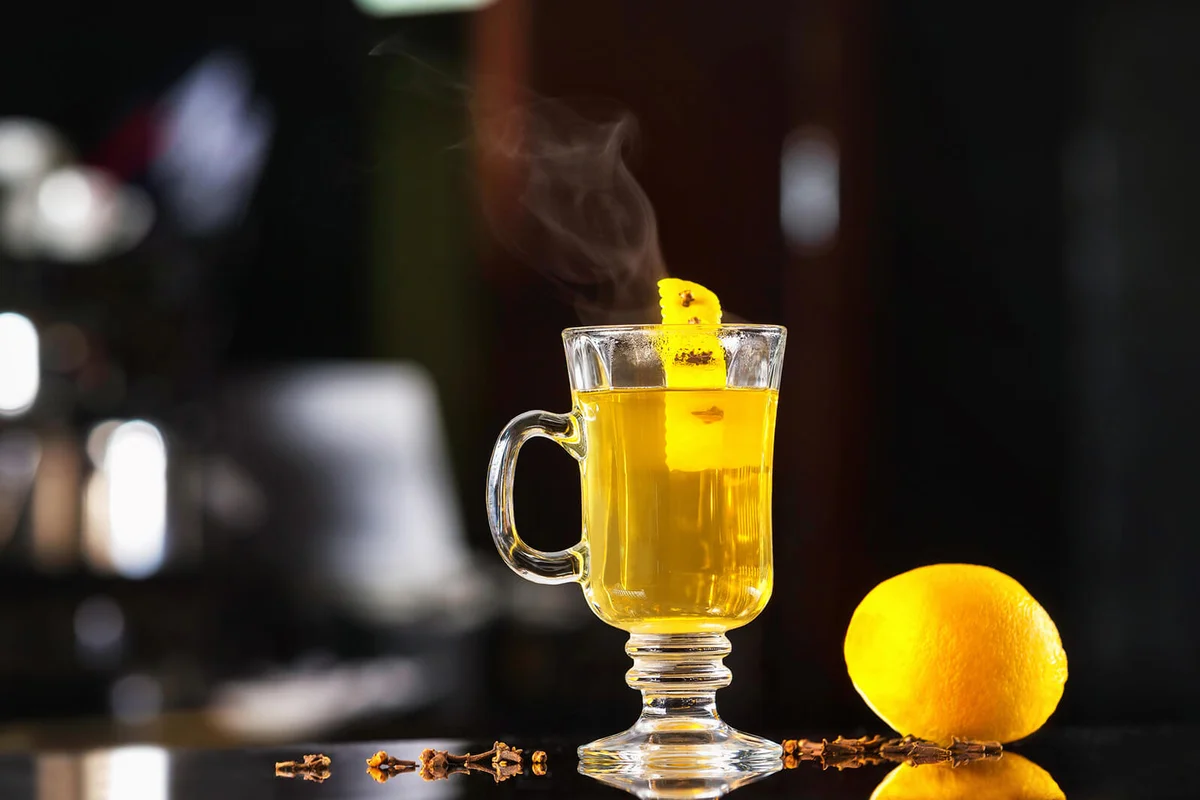 hot herbal tea with lemon at dark bar stand | Photo 118423640 © Andrei Ivanov | Dreamstime.com