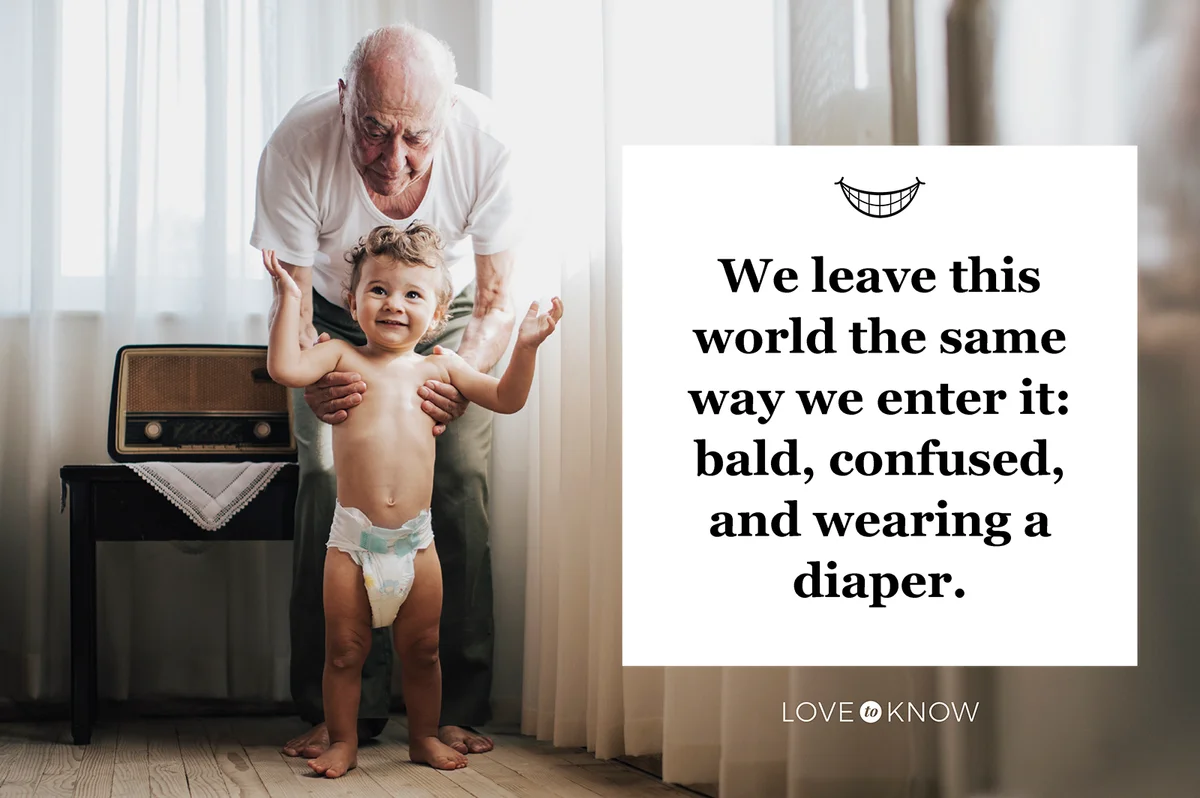 Grandfather holding his grandson that is wearing diapers