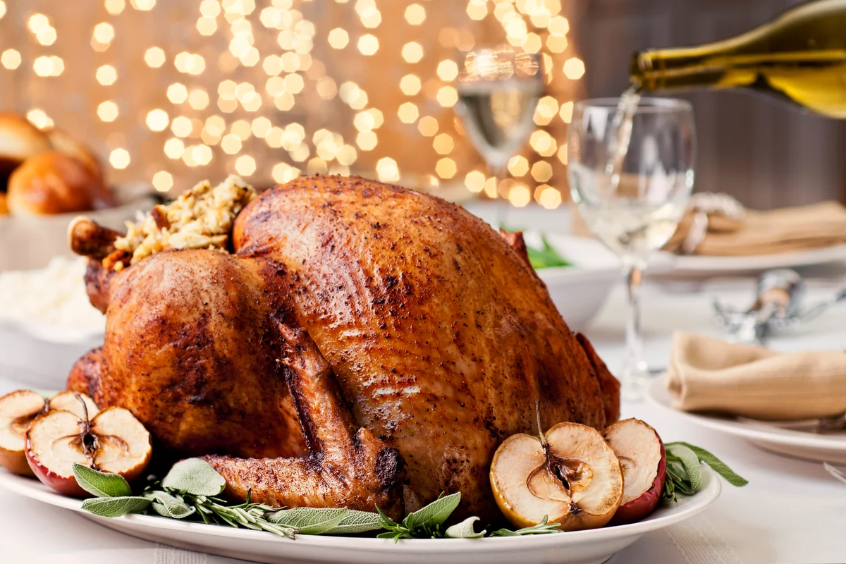 Christmas turkey with side items and white wine