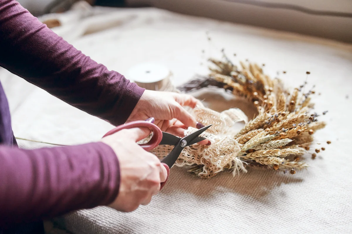 Woman making an autumn wreath