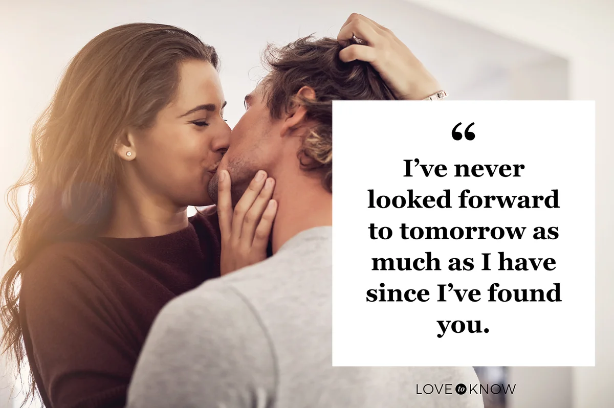 Affectionate young couple kissing at home