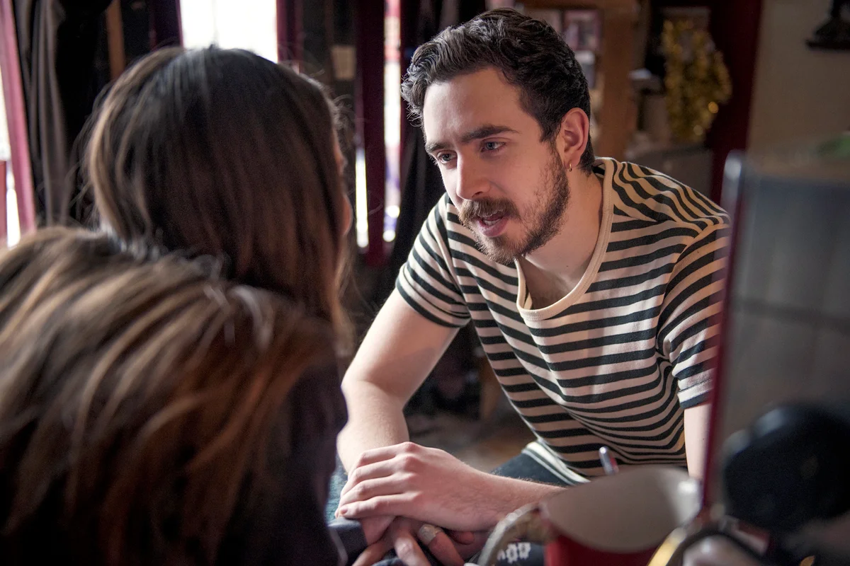 Young couple talking in coffee shop
