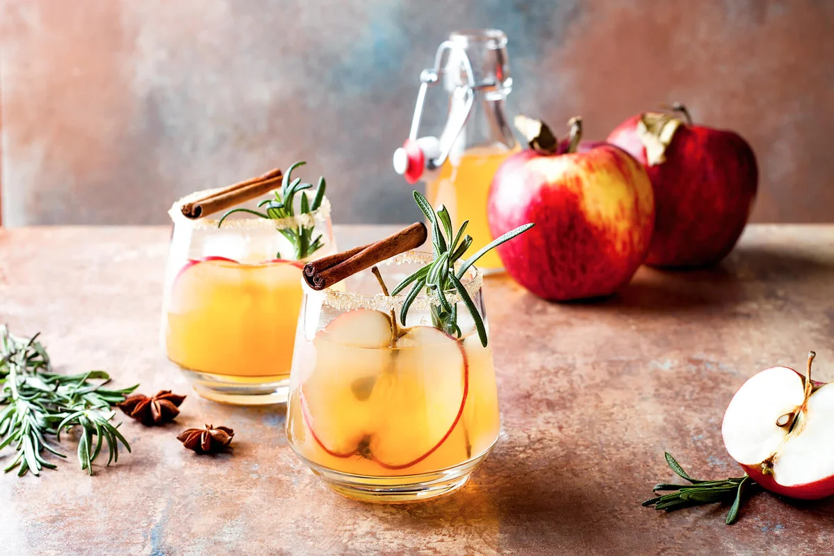 Smoky apple cider margarita fall cocktail with cinnamon, rosemary and star anise