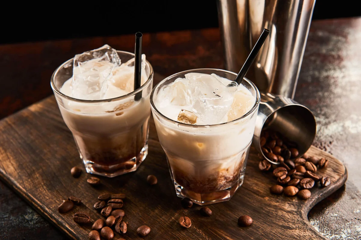 White russian cocktail in glasses with straws