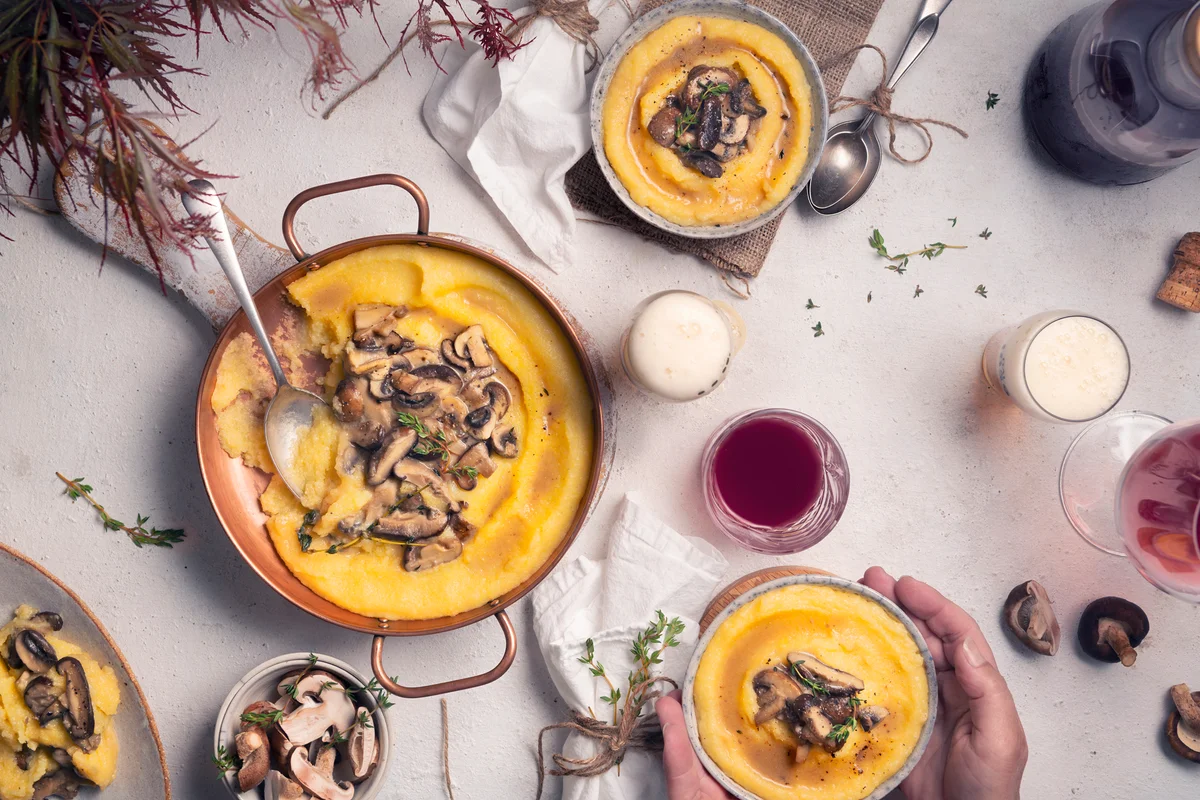 Polenta with shiitake mushroom table with wine glass