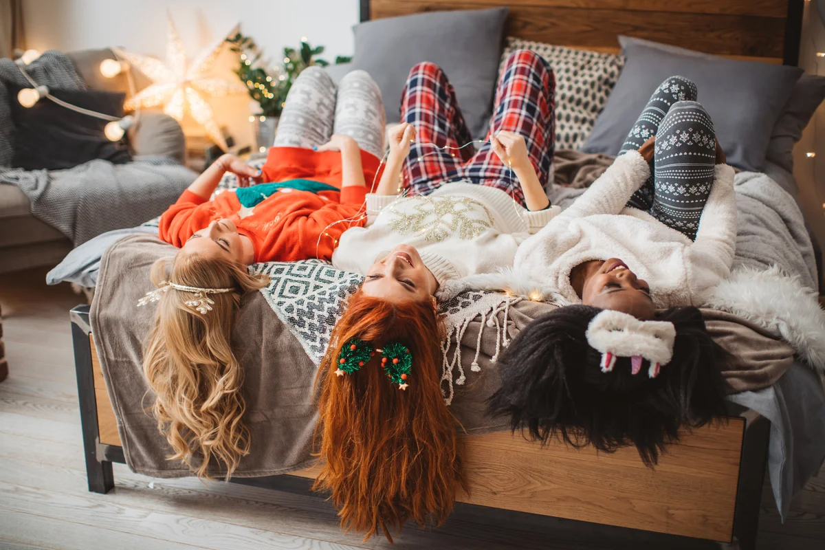 Three young women having pajama party