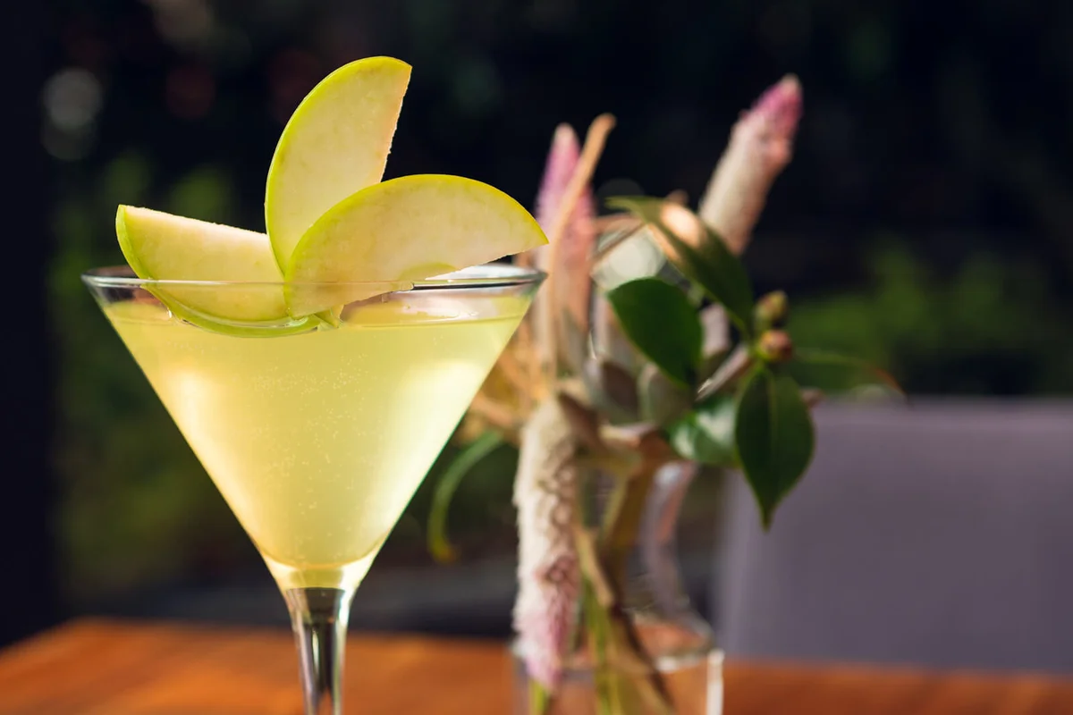 Apple martini on wooden table
