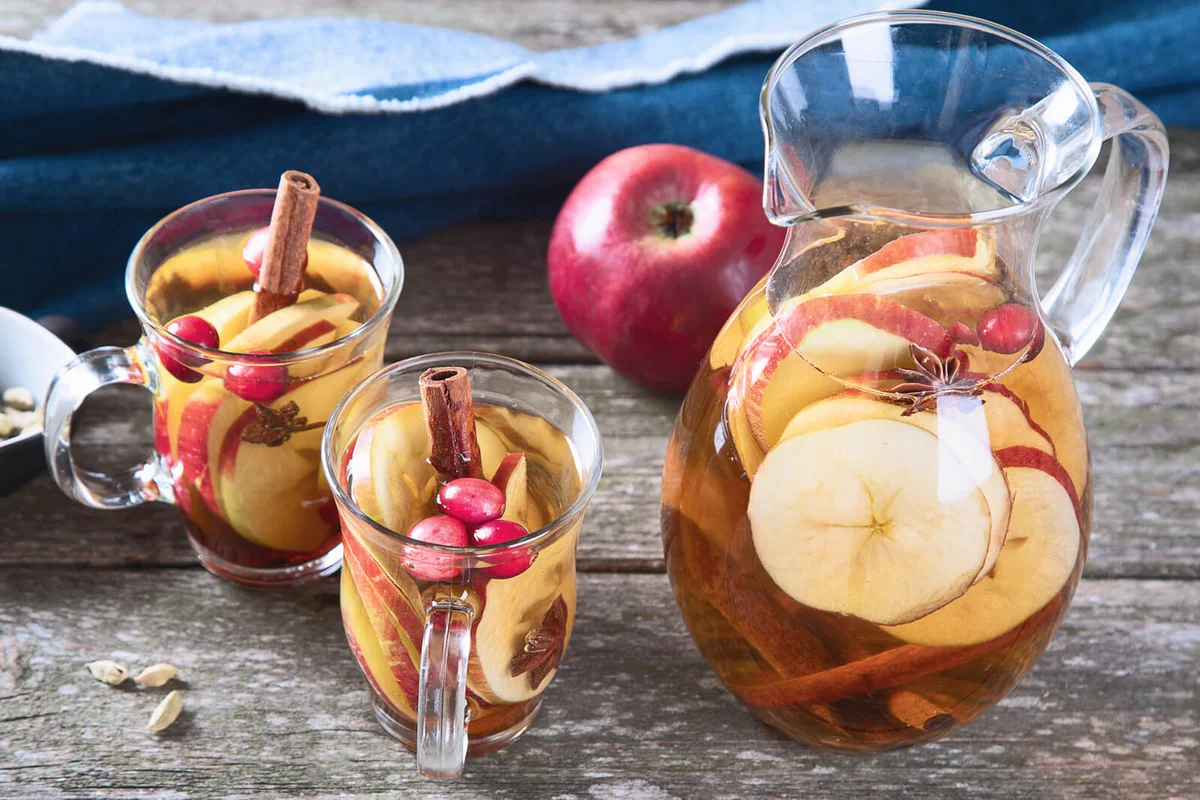 Apple cider cocktail with cranberries cinnamon